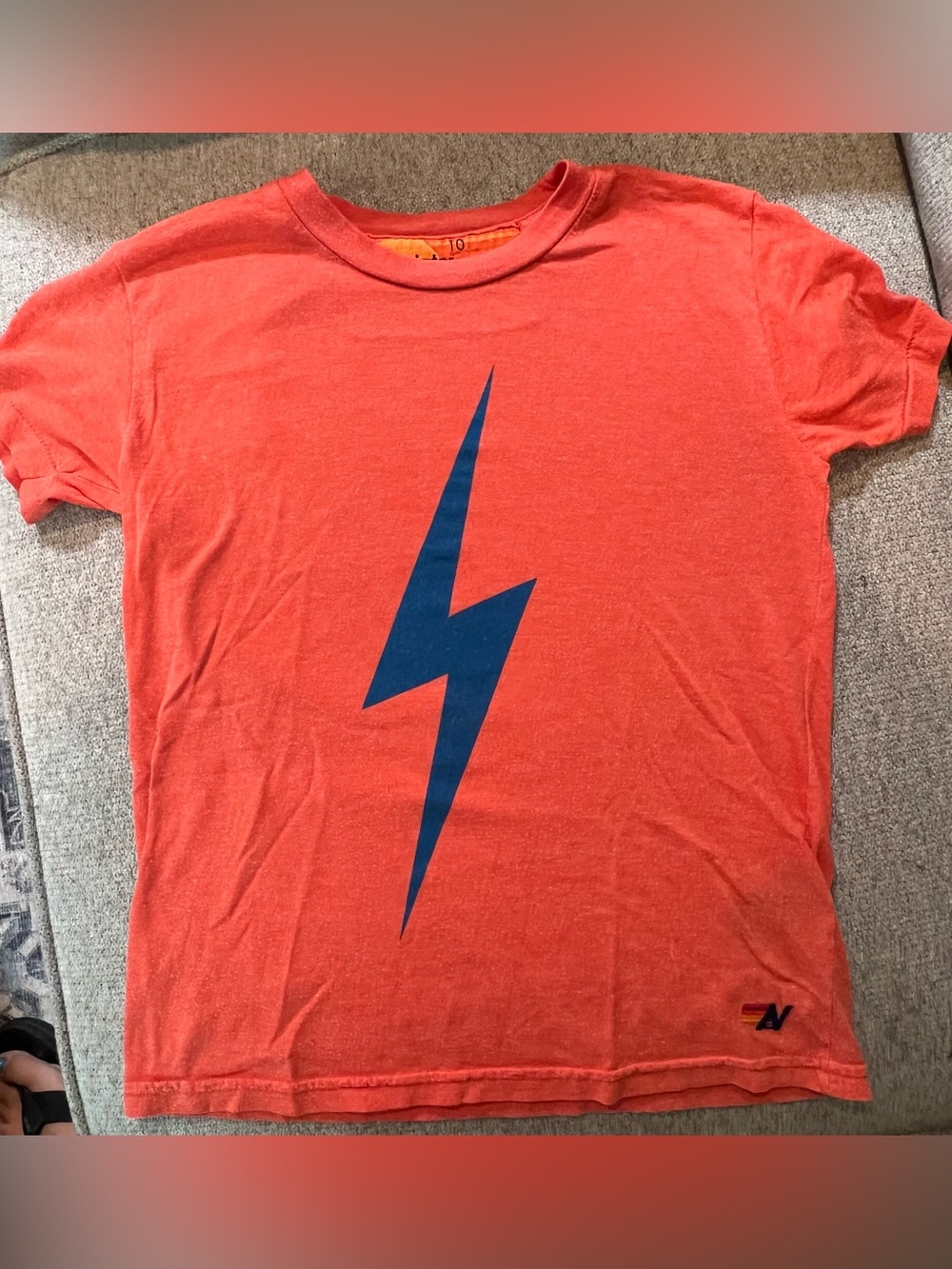 Aviator Nation Orange Tee with Blue Lightning Graphic